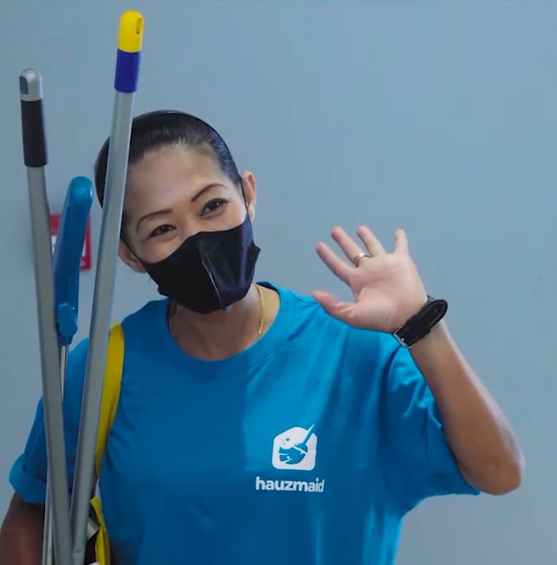 Hauzmaid cleaner in branded blue uniform